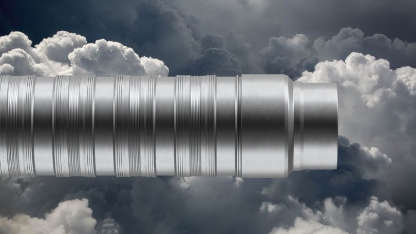 Close up of a WAB completion tool set against a cloudy sky background, highlighting advanced sealing technology for efficient zonal isolation.