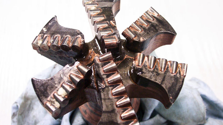 Close up of milling scale on electric wireline