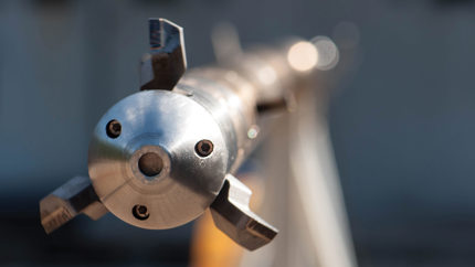 Stack of pipes with protective caps, typically used in plug and abandonment operations in the oil and gas industry.